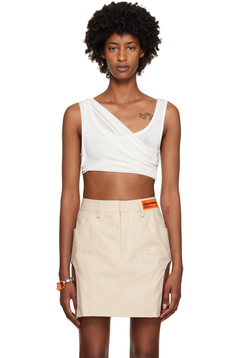 Semi-sheer knit stretch viscose tank top. 

· V-neck 
· Twisted accent at cropped hem 
· Halter strap
· Logo patch at low back 

Supplier color: White/No color