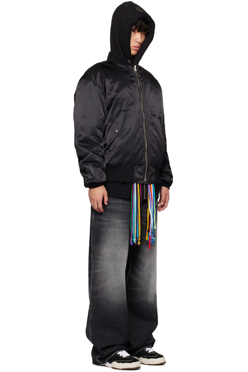 Padded nylon satin bomber jacket. Zip pockets and utility pockets throughout.

· Rib knit stand collar, hem, and cuffs
· Zip closure
· Flap pockets
· Welt pockets at interior
· D-ring at interior
· Detachable logo-woven strap at interior
· Logo-engraved silver-tone and gold-tone hardware

Part of the Mastermind World x Phenomenon collaboration.

Supplier color: Black