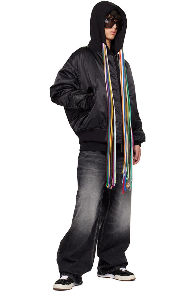 Padded nylon satin bomber jacket. Zip pockets and utility pockets throughout.

· Rib knit stand collar, hem, and cuffs
· Zip closure
· Flap pockets
· Welt pockets at interior
· D-ring at interior
· Detachable logo-woven strap at interior
· Logo-engraved silver-tone and gold-tone hardware

Part of the Mastermind World x Phenomenon collaboration.

Supplier color: Black