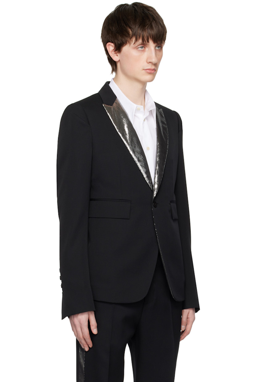 Wool gabardine blazer. 

· Metallic thread detailing at notched lapel
· Single-button closure
· Flap pockets
· Darts at front and back
· Padded shoulders
· Four-button surgeon's cuffs
· Central vent at back hem
· Welt pockets at interior
· Partial satin lining
· Horn hardware

Supplier color: Black/Silver