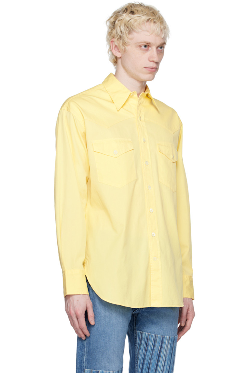 Garment-dyed cotton twill shirt.

· Spread collar
· Button closure
· Flap pockets
· Shirttail hem
· Single-button barrel cuffs
· Mother-of-pearl hardware

Supplier color: Citron