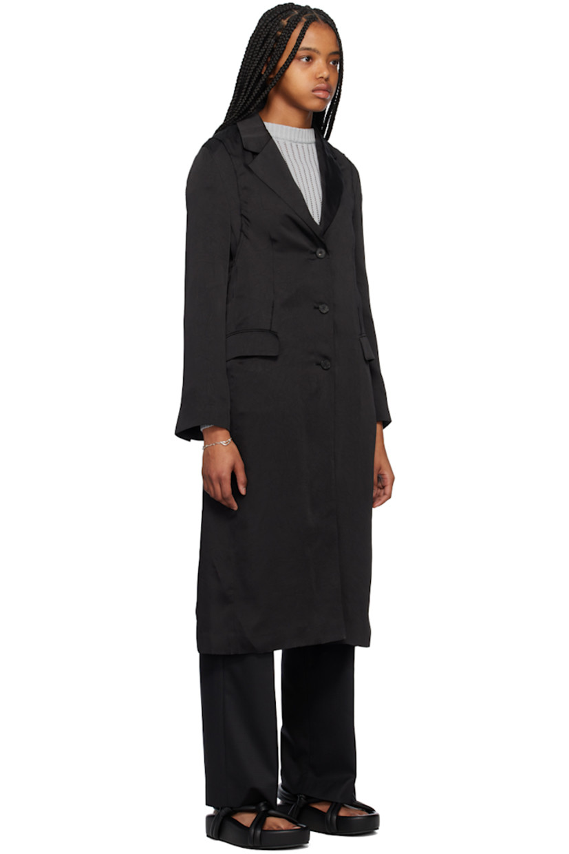 Polyester crushed satin coat. 

· Notched lapel
· Button closure
· Flap pockets
· Three-button surgeon's cuffs
· Central vent at back hem
· Full cupro satin lining

Supplier color: Black