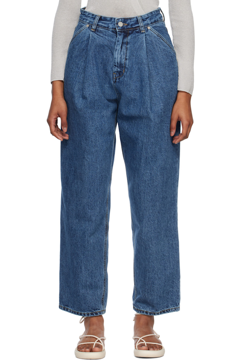 Wide-leg 14 oz non-stretch organic cotton Okayama denim jeans. 

· Belt loops
· Zip-fly
· Four-pocket styling
· Pleated front
· Leather logo patch at back waistband
· Contrast stitching in tan

Supplier color: Medium blue