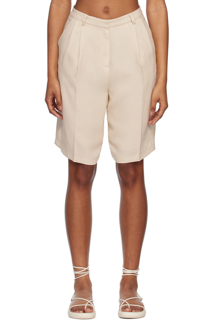 Polyester hopsack shorts. 

· Low-rise
· Belt loops
· Four-pocket styling
· Zip fly
· Pleats at waist
· Full viscose-blend satin lining

Supplier color: Ivory