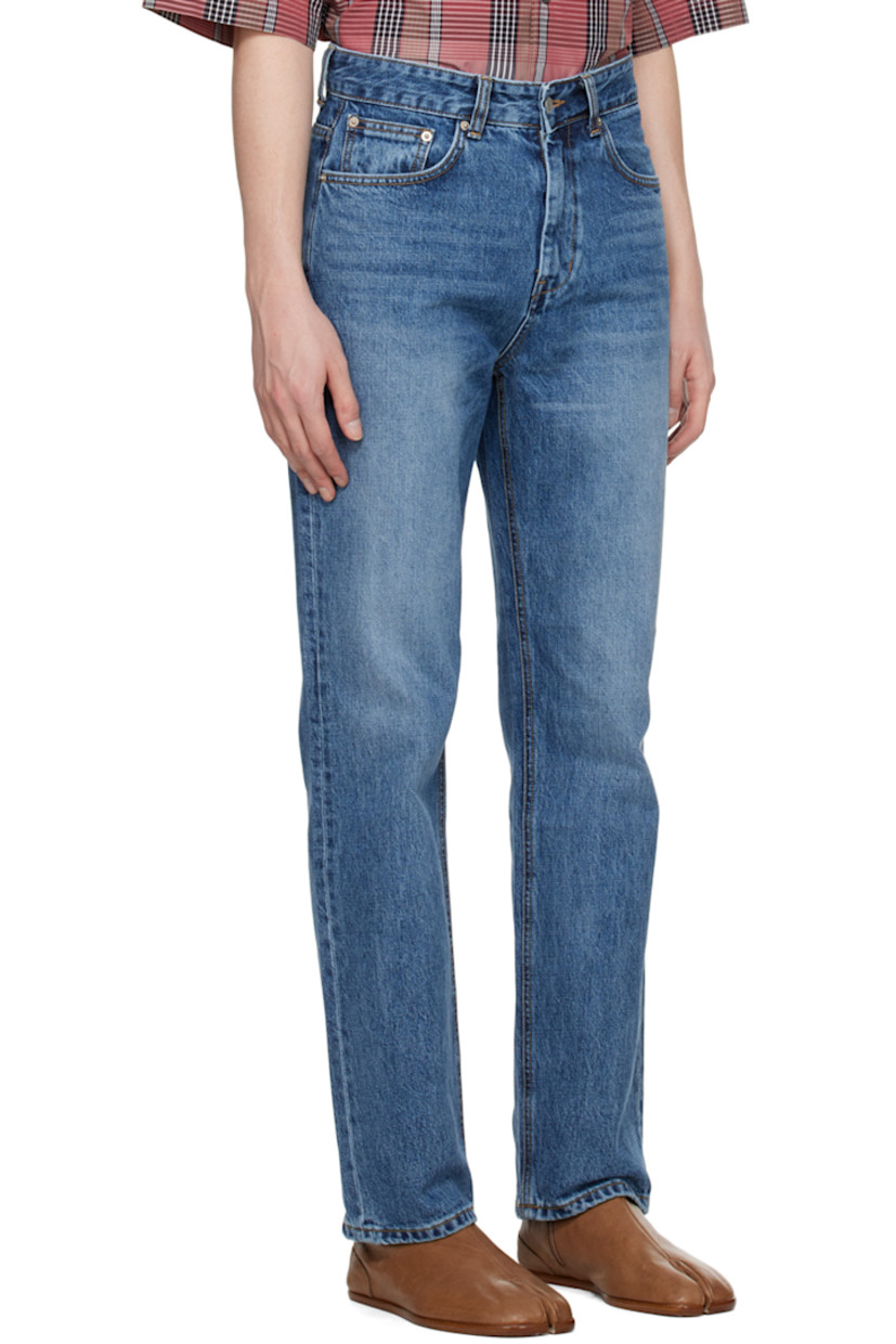 Non-stretch Okayama organic cotton denim jeans. Fading and whiskering throughout. 

· Belt loops
· Five-pocket styling
· Zip-fly
· Leather logo patch at back waistband
· Logo-engraved silver-tone hardware

Supplier color: Medium blue