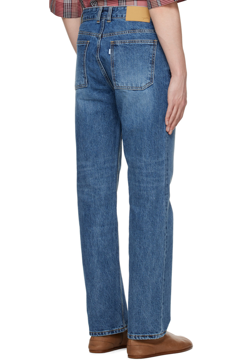 Non-stretch Okayama organic cotton denim jeans. Fading and whiskering throughout. 

· Belt loops
· Five-pocket styling
· Zip-fly
· Leather logo patch at back waistband
· Logo-engraved silver-tone hardware

Supplier color: Medium blue