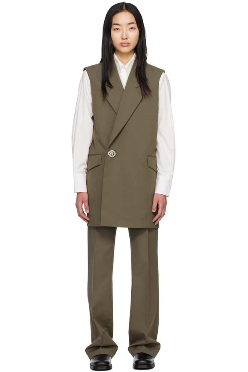 Cotton- and wool-blend twill dress.

· Notched lapel
· Twist-lock closure
· Flap pockets 
· Welt pocket at interior
· Full satin lining

Supplier color: Khaki green