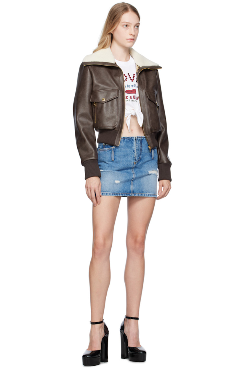 Non-stretch denim skirt. Distressing and fading throughout. 

· Five-pocket styling
· Zip-fly
· Logo patch at coin pocket
· Belt loops at front and back
· Contrast stitching in tan
· Logo-engraved silver-tone hardware

Supplier color: Denim