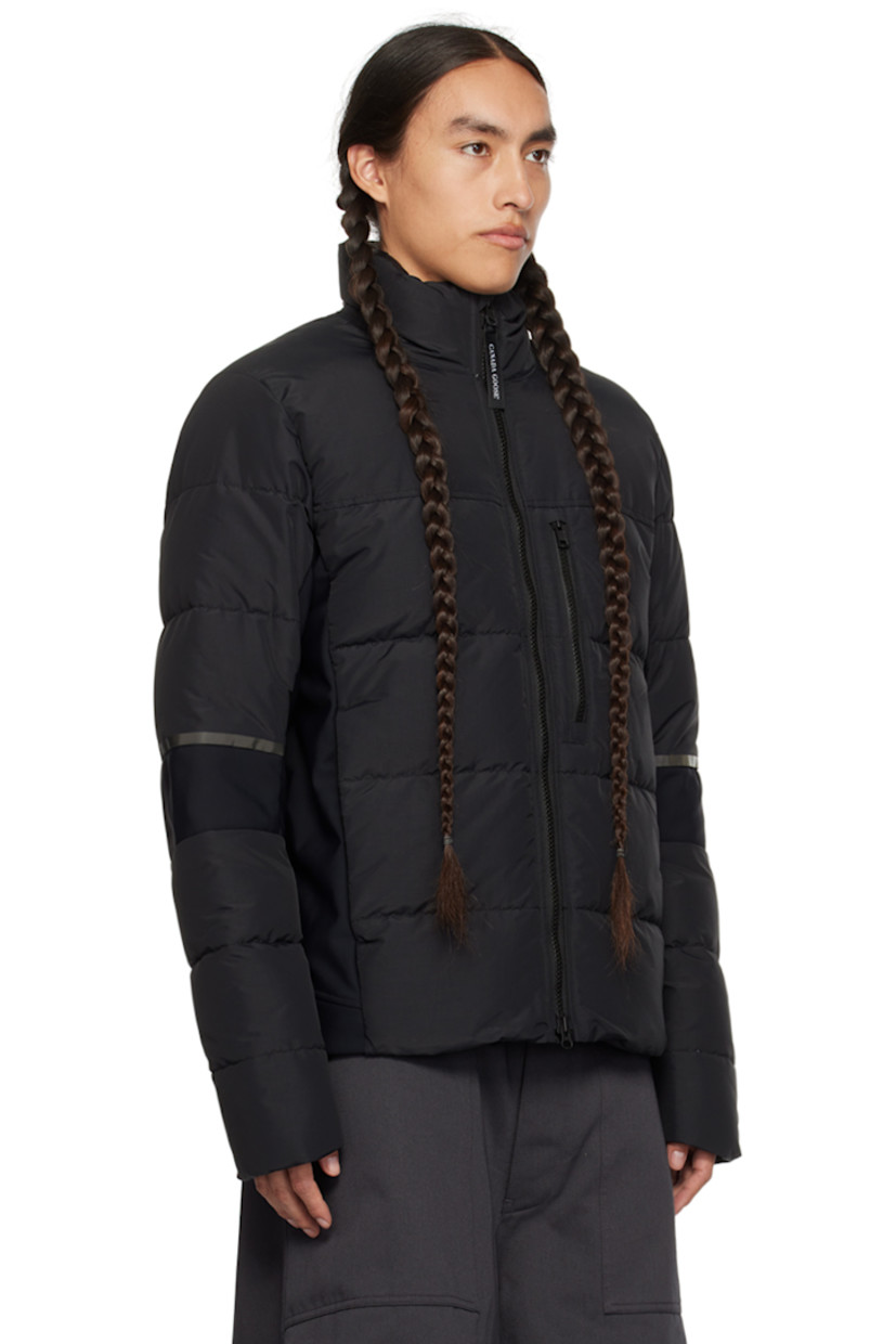 Down-filled quilted water-repellent CORDURA® nylon faille and stretch nylon jersey jacket. Reflective trim throughout.

· Paneled construction 
· Stand collar
· Two-way zip closure
· Zip pockets
· Logo patch at sleeve
· Inset Power Stretch® jersey cuffs
· Elasticized straps and patch pocket at interior
· Full laqué lining

Supplier color: Black

Fill: 90% duck down, 10% duck feather.