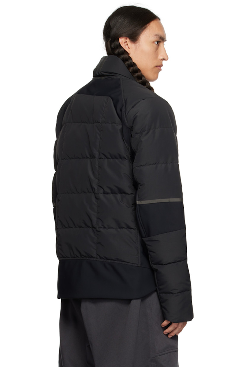 Down-filled quilted water-repellent CORDURA® nylon faille and stretch nylon jersey jacket. Reflective trim throughout.

· Paneled construction 
· Stand collar
· Two-way zip closure
· Zip pockets
· Logo patch at sleeve
· Inset Power Stretch® jersey cuffs
· Elasticized straps and patch pocket at interior
· Full laqué lining

Supplier color: Black

Fill: 90% duck down, 10% duck feather.