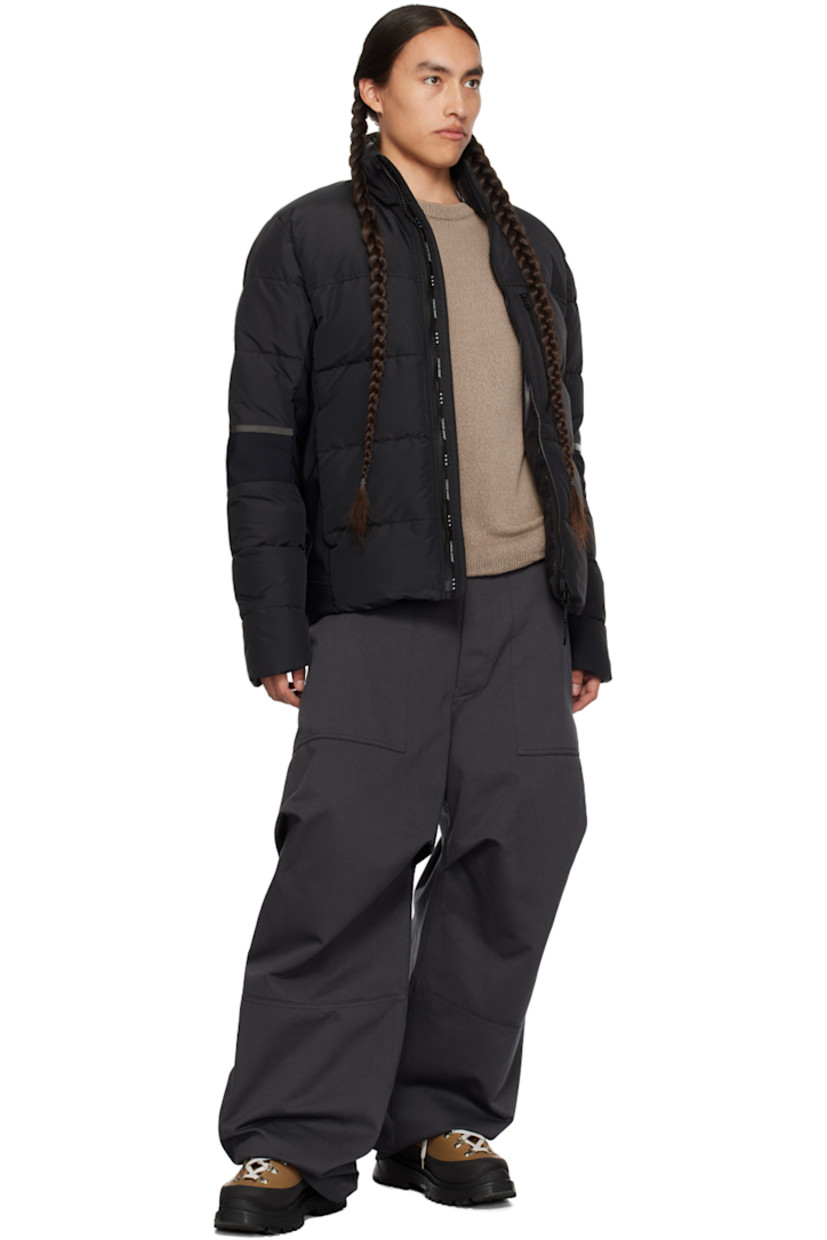 Down-filled quilted water-repellent CORDURA® nylon faille and stretch nylon jersey jacket. Reflective trim throughout.

· Paneled construction 
· Stand collar
· Two-way zip closure
· Zip pockets
· Logo patch at sleeve
· Inset Power Stretch® jersey cuffs
· Elasticized straps and patch pocket at interior
· Full laqué lining

Supplier color: Black

Fill: 90% duck down, 10% duck feather.