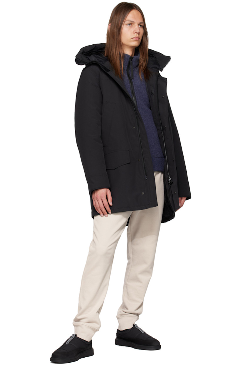 Water-repellent RDS-certified down-filled Arctic Tech® polyester- and cotton-blend canvas jacket.

· Detachable trim and cinch strap at hood
· Funnel neck
· Two-way zip closure and press-stud placket
· Welt and flap pockets
· Logo patch at sleeve
· CORDURA® piping trim at cuffs
· Inset rib knit cuffs
· Zip pocket and patch pockets at interior
· Elasticized shoulder straps at interior
· Full nylon taffeta lining

Supplier color: Black/Noir

Fill: 80% duck down, 20% duck feather.