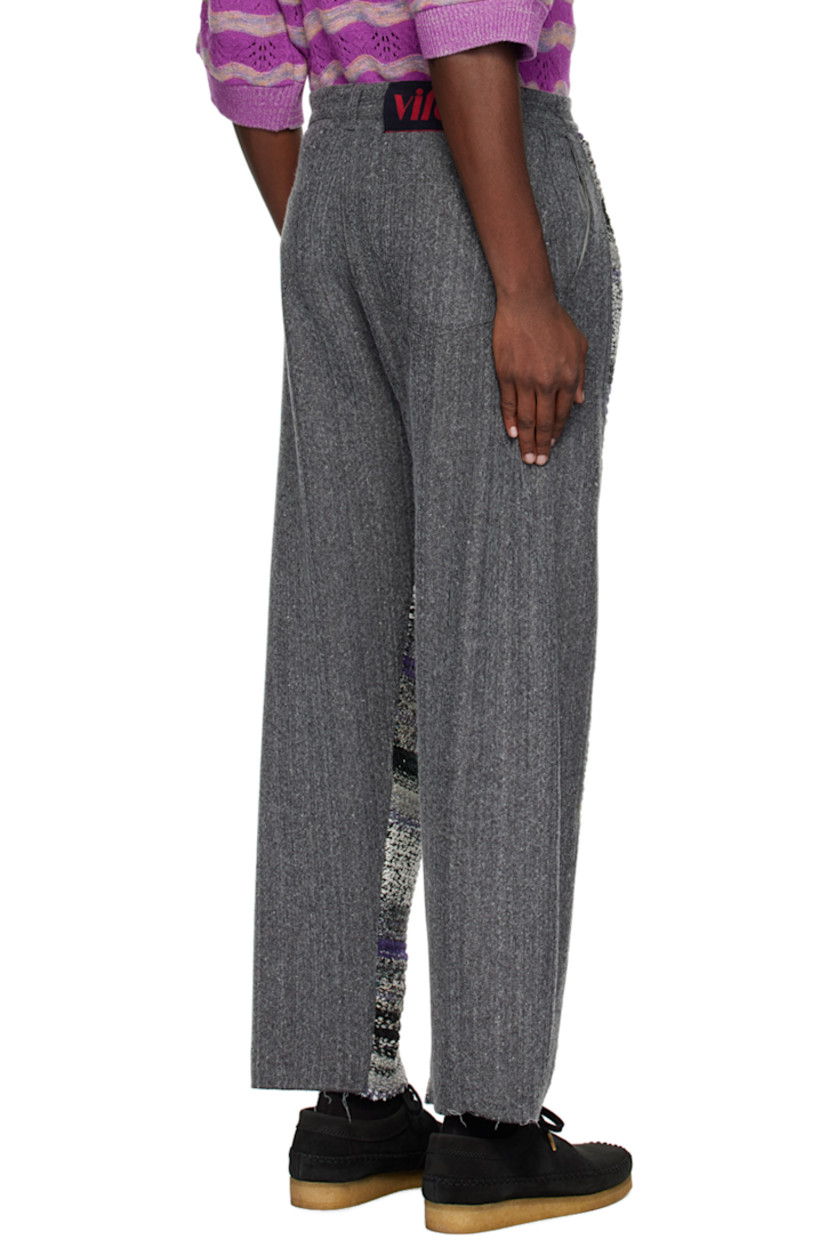 Paneled non-stretch denim and knit wool-blend jeans.

· Belt loops
· Three-pocket styling
· Zip-fly
· Logo patch at back waistband

Supplier color: Grey
