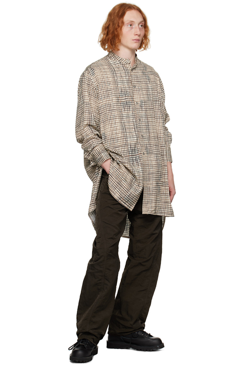 Viscose twill shirt. Check pattern printed throughout.

· Band collar
· Press-stud closure
· Drop-tail hem
· Single-press-stud barrel cuffs
· Gathering at back yoke

Supplier color: Printed check
