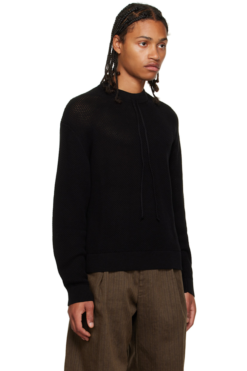 Open knit cotton crewneck. 

· Rib knit crewneck, hem, and cuffs
· Drawstring at collar

Supplier color: Black