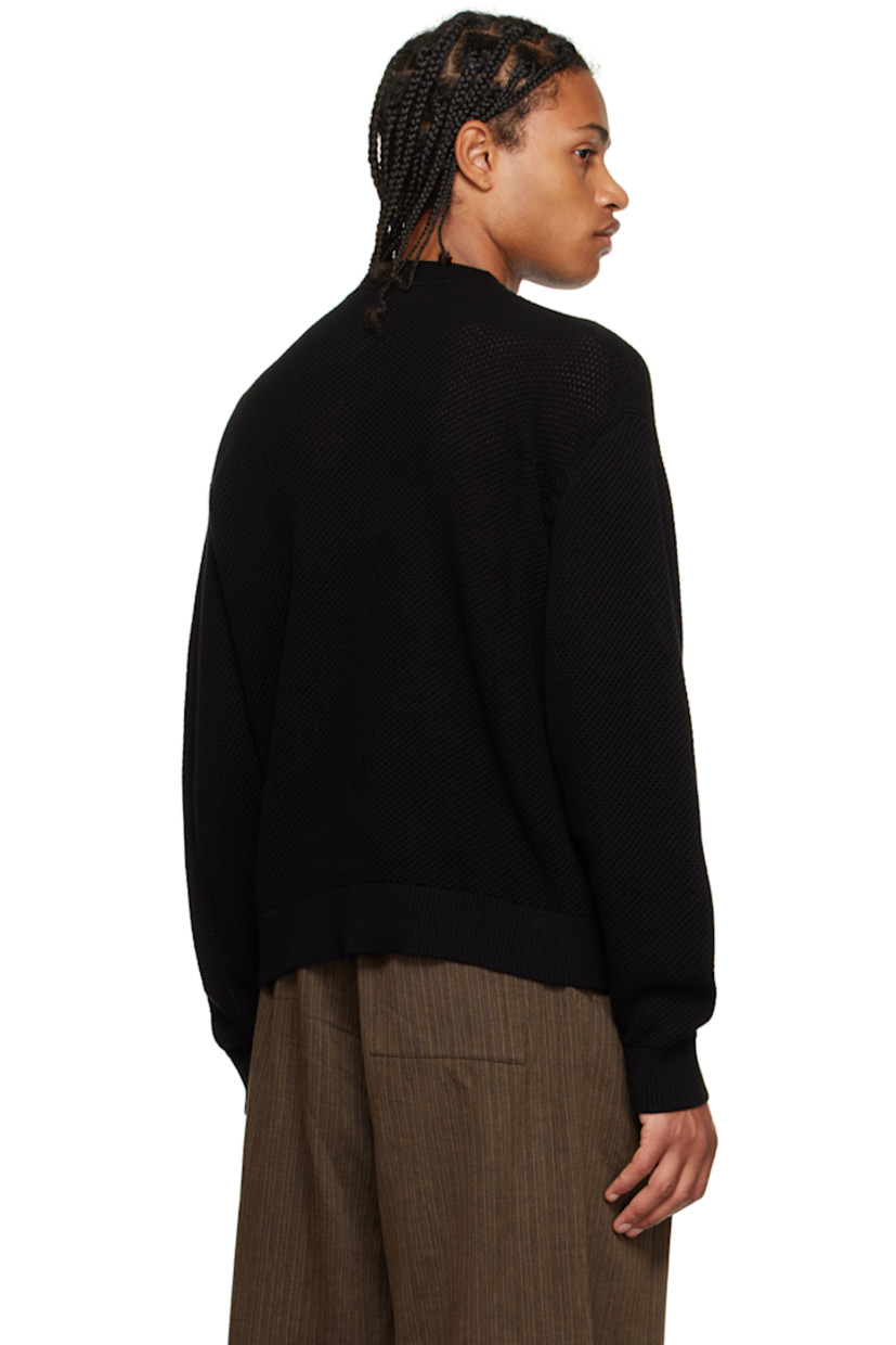 Open knit cotton crewneck. 

· Rib knit crewneck, hem, and cuffs
· Drawstring at collar

Supplier color: Black