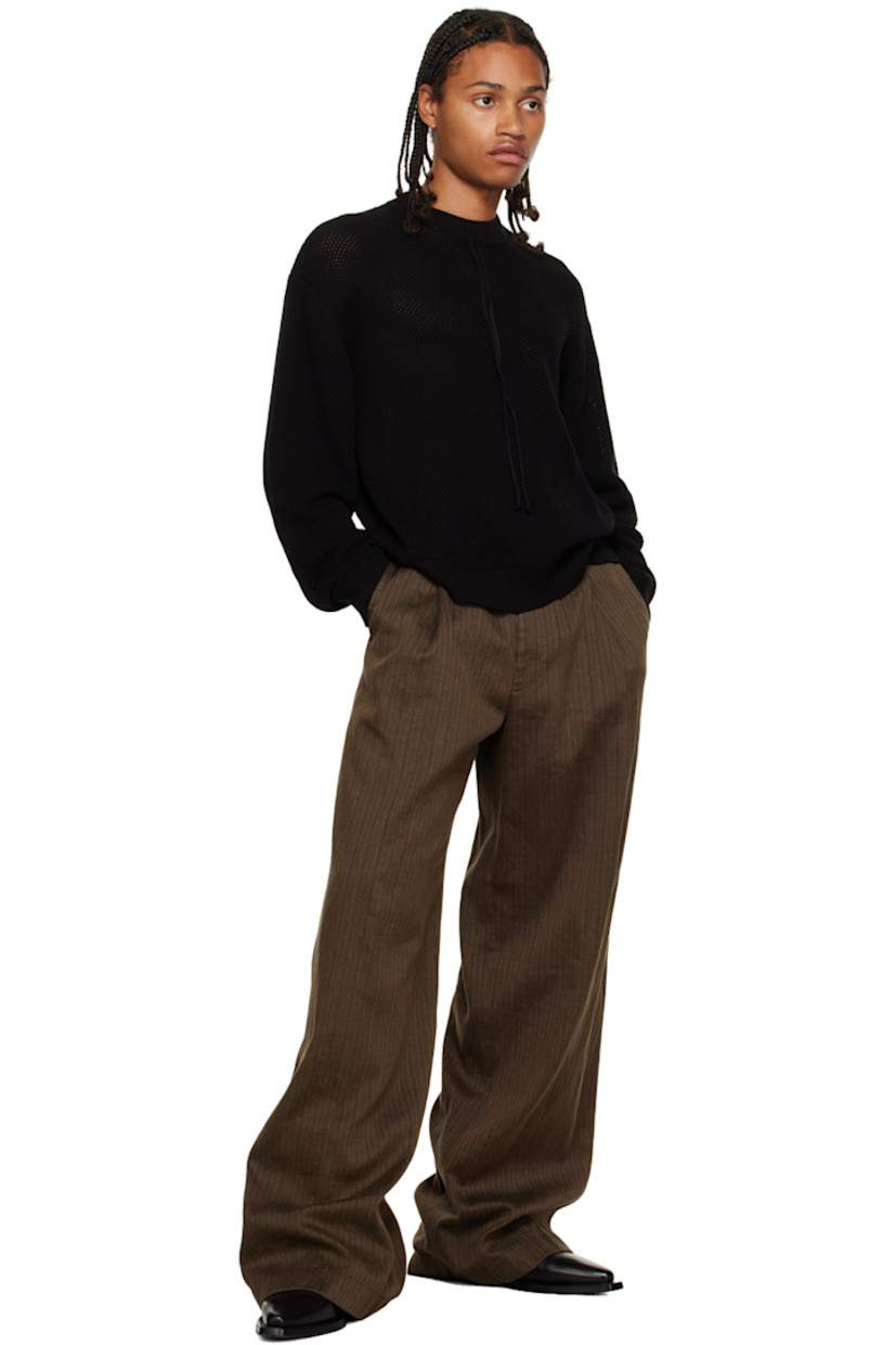 Open knit cotton crewneck. 

· Rib knit crewneck, hem, and cuffs
· Drawstring at collar

Supplier color: Black