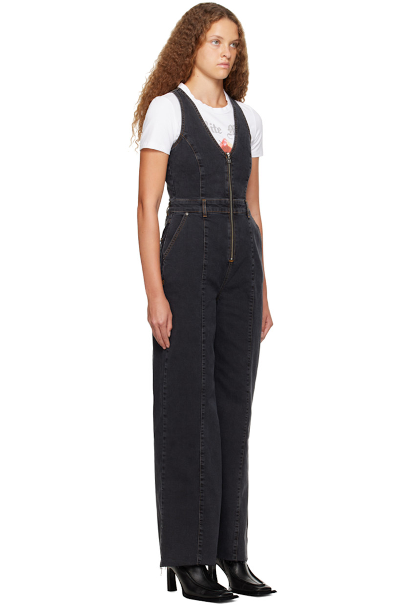 Stretch denim jumpsuit. Flap pockets throughout.

· V-neck
· Zip closure
· Four-pocket styling 
· Belt loops
· Raw edge at hem
· Graphic embroidered at back waist
· Logo embroidered at back

Supplier color: Black