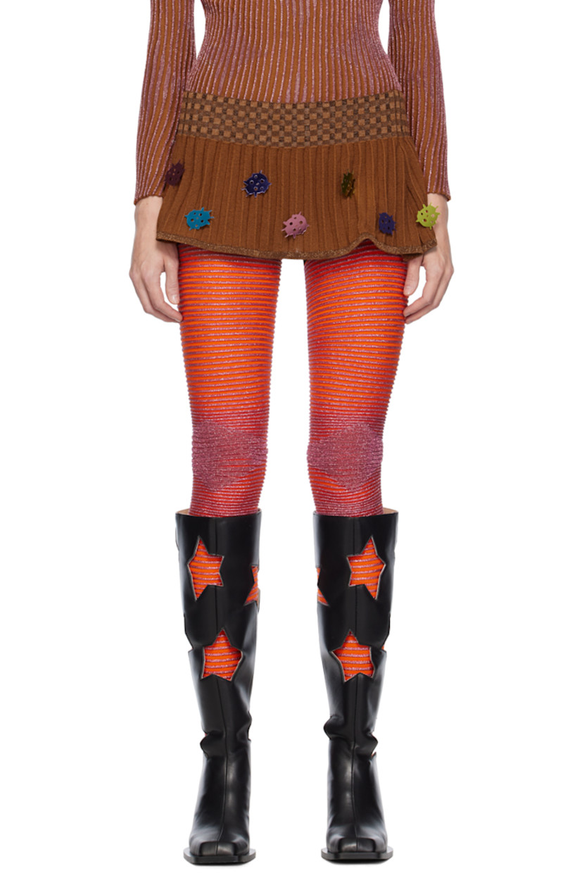 Knit merino wool- and nylon-blend skirt. 

· Metallic thread detailing and graphic appliqués throughout
· Check pattern at elasticized waistband

Available exclusively at SSENSE.

Supplier color: Brown/Multi
