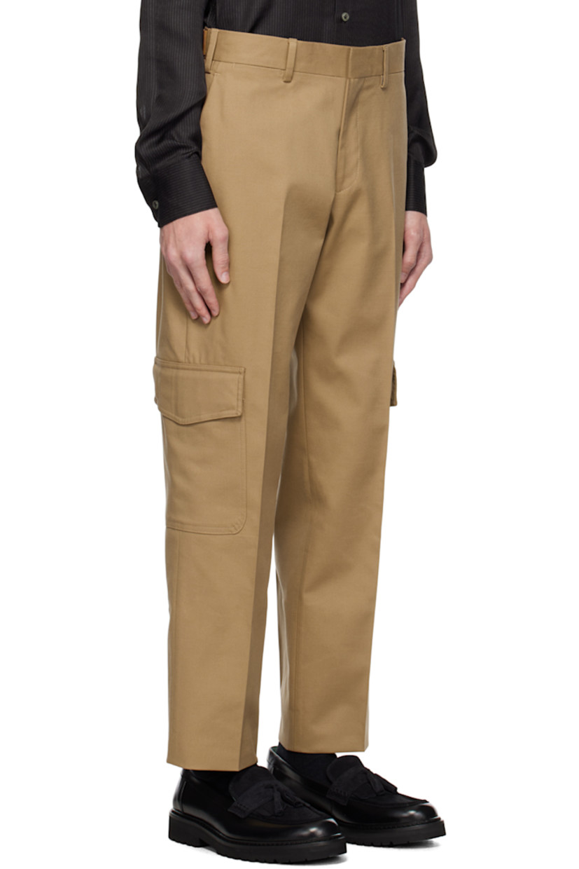 Stretch cotton- and wool-blend twill trousers.

· Belt loops
· Cinch straps and button tabs at waistband
· Four-pocket styling
· Zip-fly
· Central creases at front and back
· Flap pocket at outseams

Supplier color: Beige