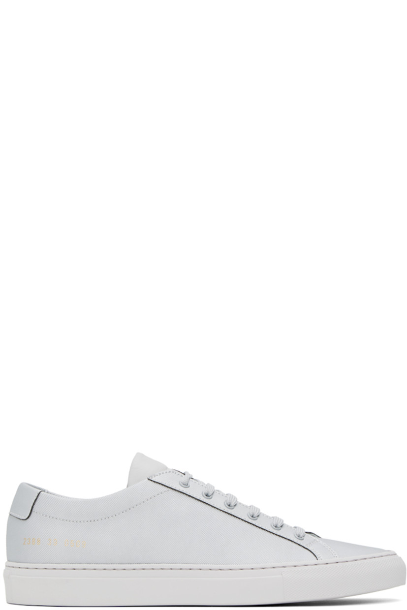 Low-top coated canvas sneakers in silver-tone. Signature series stamp at outer side.

· Lace-up closure
· Padded tongue and collar
· Suede and buffed leather lining
· Treaded rubber sole

Supplier color: Silver