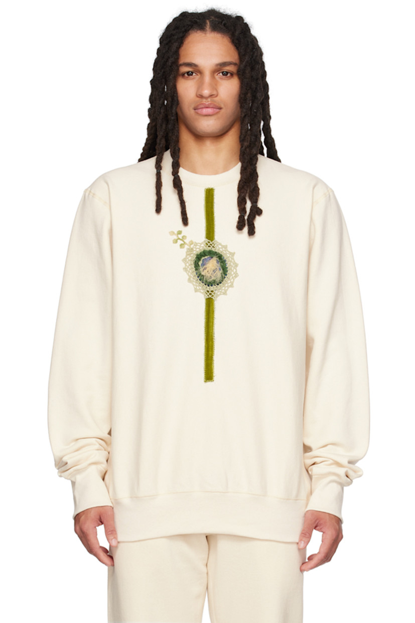Cotton fleece sweatshirt.

· Rib knit crewneck, hem, and cuffs
· Graphic appliqué and velvet trim at front

Supplier color: Cream