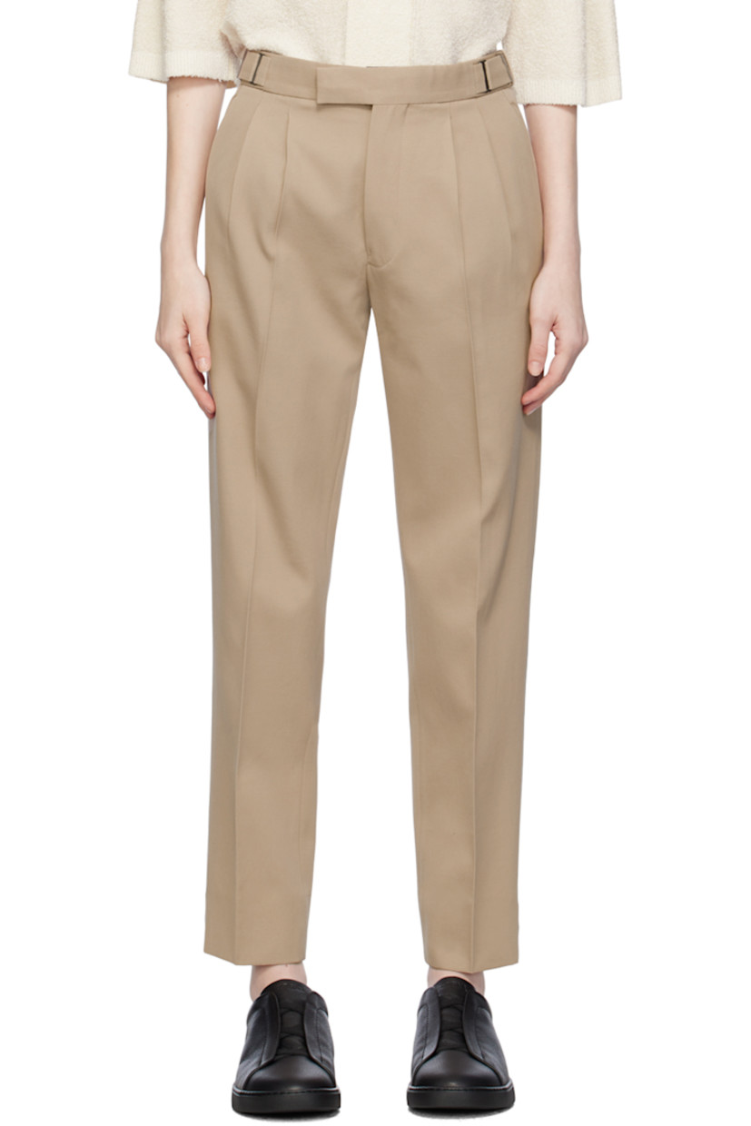 Cotton- and wool-blend twill trousers. 

· High-rise
· Integrated cinch belt at waistband 
· Four-pocket styling
· Zip-fly
· Pleats at front waistband
· Central creases at front 
· Adjustable button tabs at cuffs 
· Partial cotton twill lining 

Supplier color: Beige