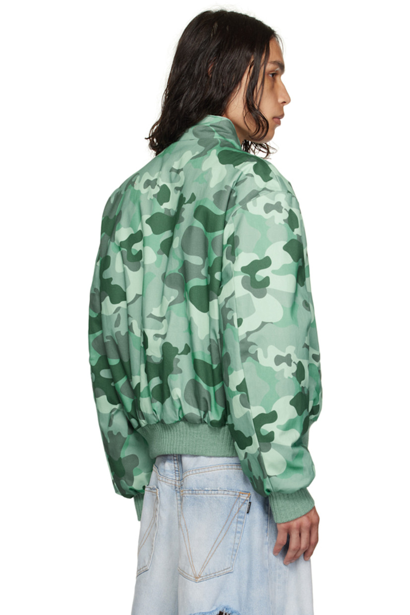Insulated stretch cotton twill bomber jacket. Camouflage pattern printed throughout.

· Stand collar
· Zip closure
· Welt pockets
· Rib knit hem and cuffs
· Welt pocket at interior
· Full stretch cotton twill lining

Supplier color: Lt camo shade