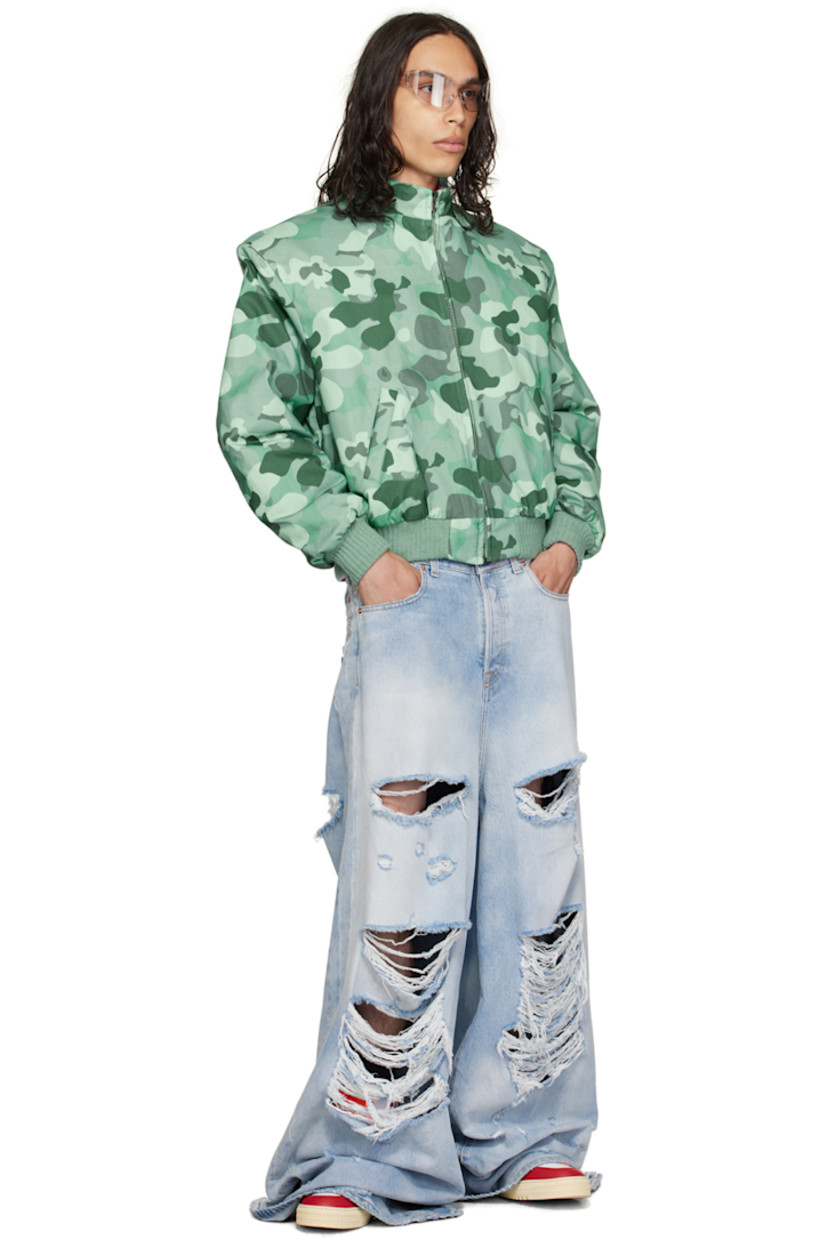 Insulated stretch cotton twill bomber jacket. Camouflage pattern printed throughout.

· Stand collar
· Zip closure
· Welt pockets
· Rib knit hem and cuffs
· Welt pocket at interior
· Full stretch cotton twill lining

Supplier color: Lt camo shade