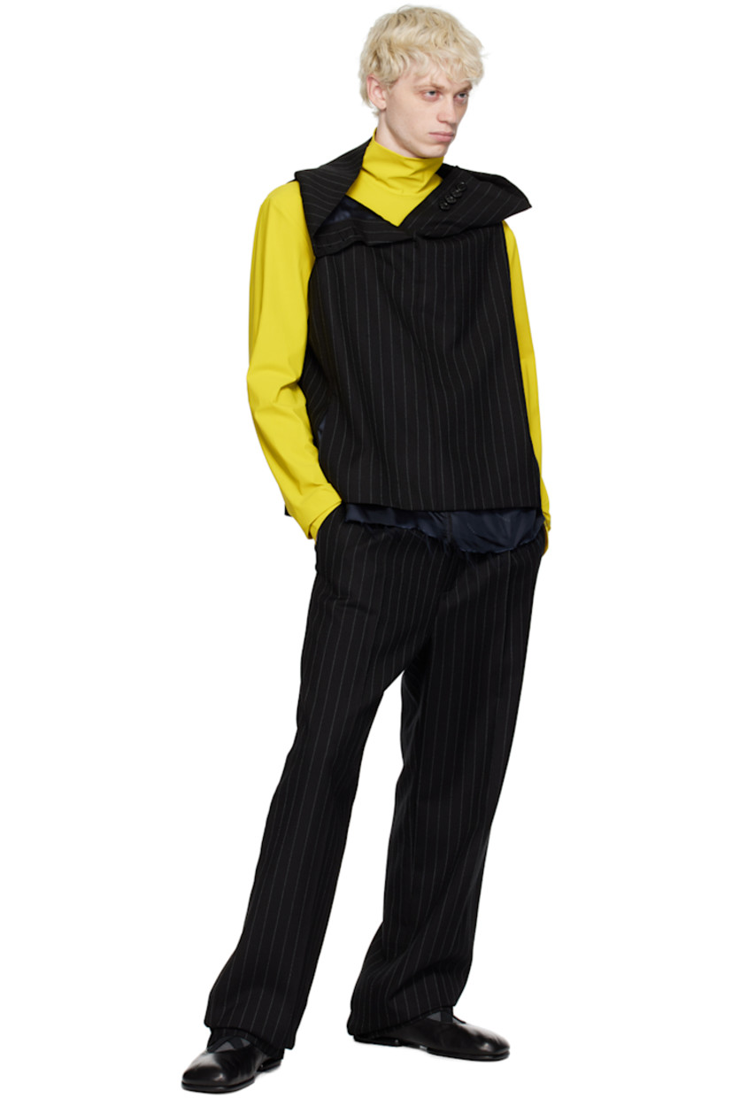 Wool twill tank top. Pinstripes throughout. 

· Four-button placket at foldover collar
· Raw edge at hem
· Seam pockets
· Full logo-woven satin lining

Supplier color: Pinstripe