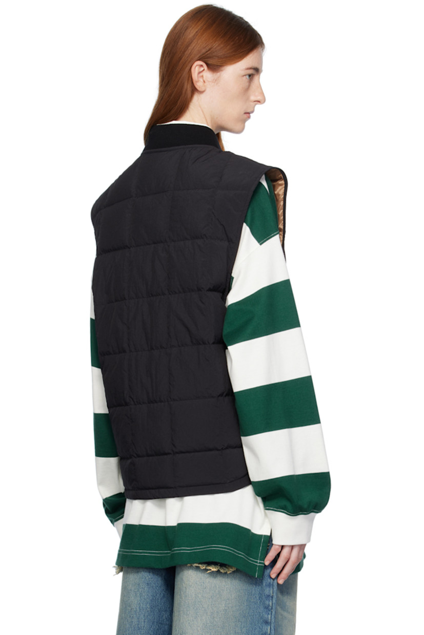 Down-filled quilted nylon taffeta vest. 

· Rib knit stand collar 
· Zip closure 
· Chenille logo patch at chest 
· Patch pockets 
· Shirttail hem 
· Full satin lining 

Part of the Moncler Genius x Palm Angels collaboration.

Supplier color: Black 

Fill: 90% goose down, 10% feathers.