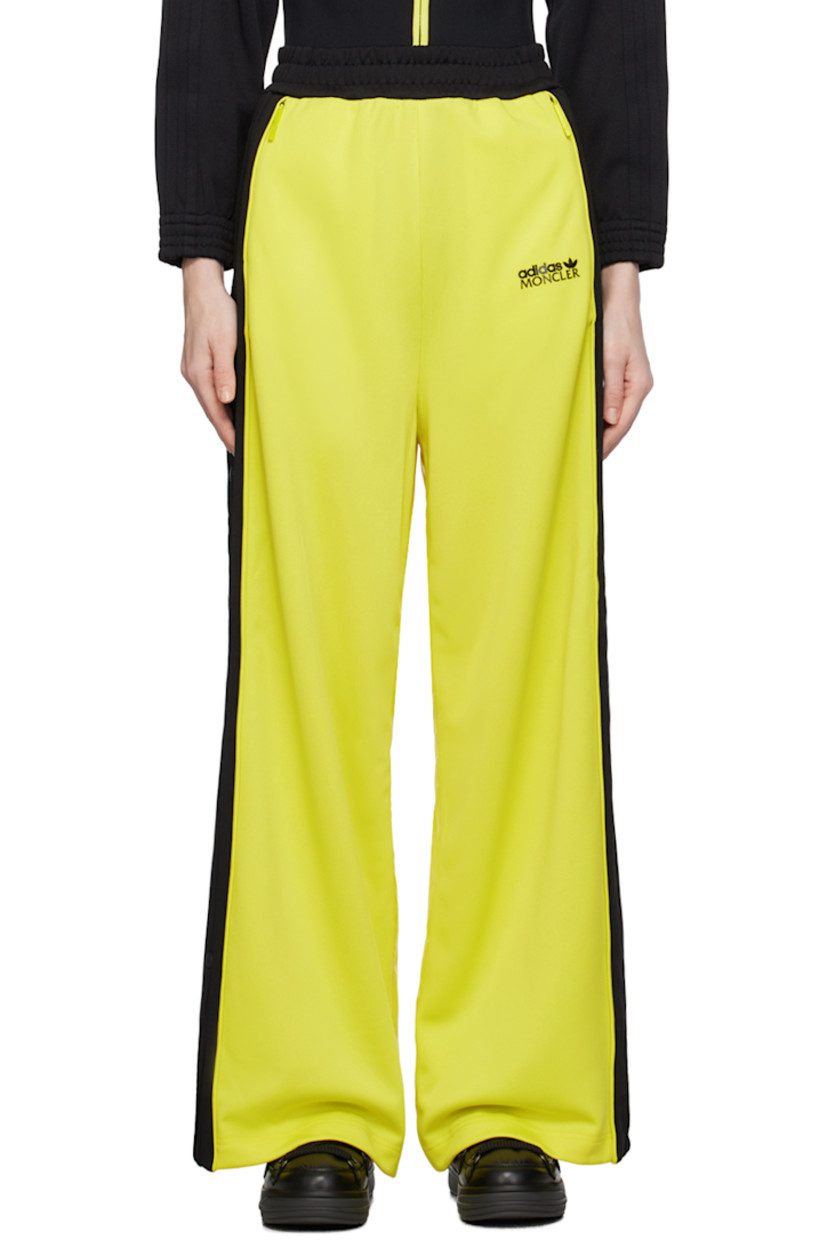 Paneled polyester jersey and nylon satin trousers. Stripe appliqués and zip vent with press-stud hardware at outseams.

· Concealed drawstring at elasticized waistband
· Two-pocket styling
· Rubberized logo patch bonded at front and back
· Rib knit elasticized cuffs
· Logo-engraved gunmetal-tone hardware

Part of the Moncler Genius x adidas Originals collaboration. 

Supplier color: Yellow