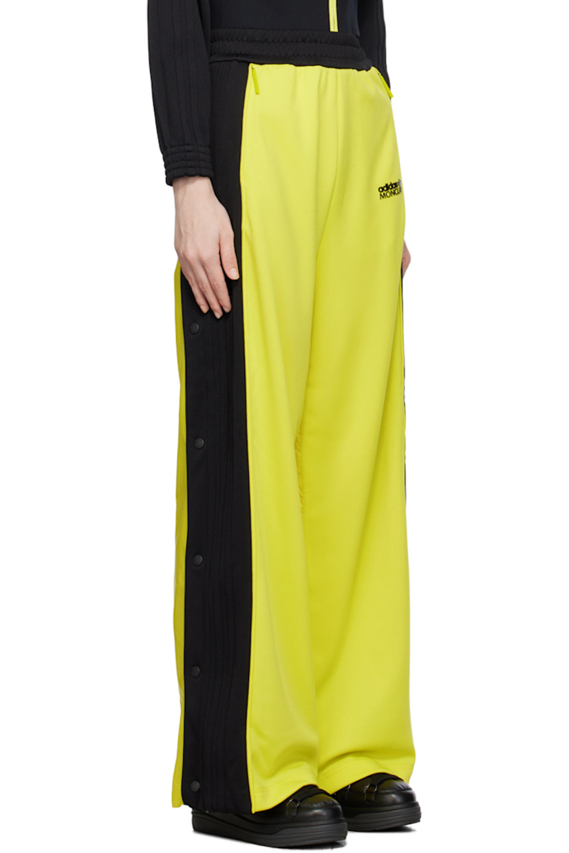 Paneled polyester jersey and nylon satin trousers. Stripe appliqués and zip vent with press-stud hardware at outseams.

· Concealed drawstring at elasticized waistband
· Two-pocket styling
· Rubberized logo patch bonded at front and back
· Rib knit elasticized cuffs
· Logo-engraved gunmetal-tone hardware

Part of the Moncler Genius x adidas Originals collaboration. 

Supplier color: Yellow