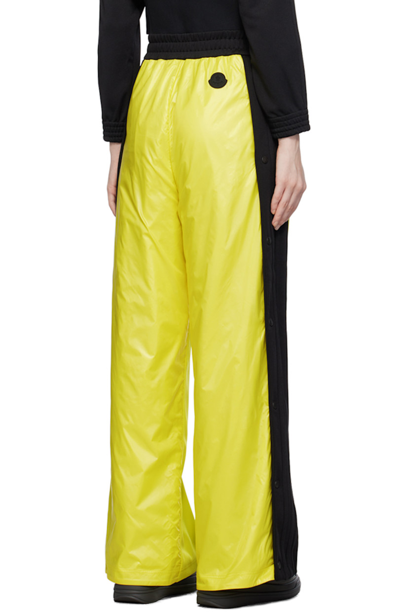 Paneled polyester jersey and nylon satin trousers. Stripe appliqués and zip vent with press-stud hardware at outseams.

· Concealed drawstring at elasticized waistband
· Two-pocket styling
· Rubberized logo patch bonded at front and back
· Rib knit elasticized cuffs
· Logo-engraved gunmetal-tone hardware

Part of the Moncler Genius x adidas Originals collaboration. 

Supplier color: Yellow