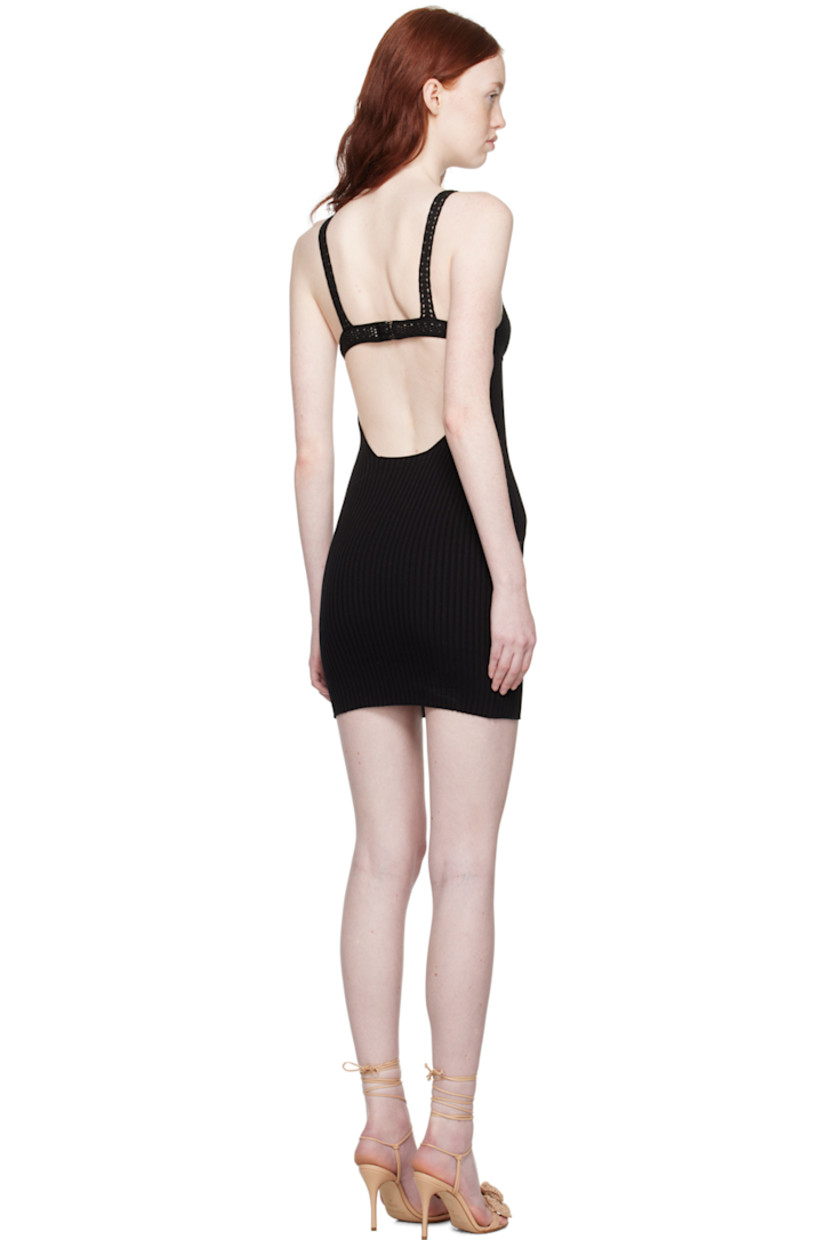 Rib knit and crocheted stretch viscose dress.

· Paneled construction 
· Sweetheart neck
· Adjustable button tab at low back
· Unlined

Supplier color: Black