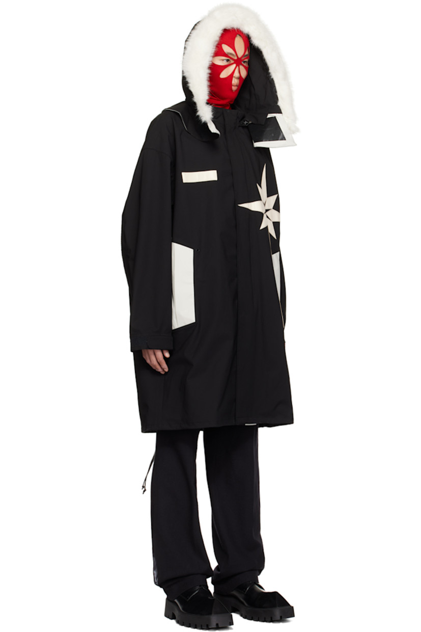 Polyester taffeta coat. 

· Paneled construction
· Faux-fur trim at detachable hood
· Stand collar
· Two-way zip closure with press-stud placket
· Faux-leather graphic patches at front and back 
· Concealed zip pockets
· Metal eyelets at front 
· Logo-embroidered zip pocket at sleeve
· Logo-embroidered velcro tab at cuffs
· Drawstring at vented fishtail hem 
· Partially lined

Supplier color: Black