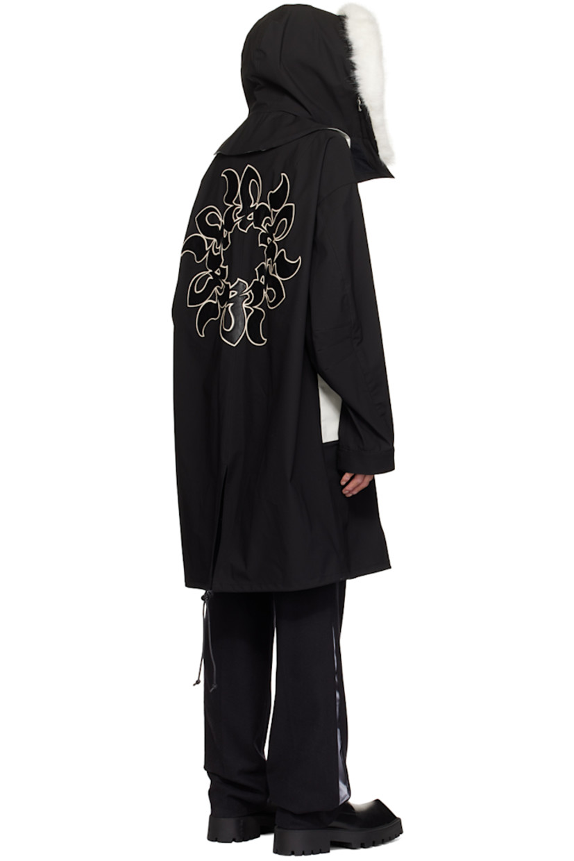 Polyester taffeta coat. 

· Paneled construction
· Faux-fur trim at detachable hood
· Stand collar
· Two-way zip closure with press-stud placket
· Faux-leather graphic patches at front and back 
· Concealed zip pockets
· Metal eyelets at front 
· Logo-embroidered zip pocket at sleeve
· Logo-embroidered velcro tab at cuffs
· Drawstring at vented fishtail hem 
· Partially lined

Supplier color: Black