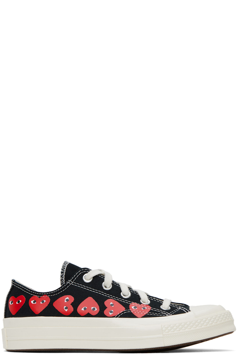 Low-top canvas sneakers in black. 

· Round rubber cap toe
· Lace-up closure
· Logo graphics printed at sides
· Metal eyelets at inner side
· Webbing trim at heel
· Logo embossed at heel
· Cushioned Ortholite® footbed
· Treaded vulcanized rubber sole

Part of the Comme des Garçons PLAY x Converse collaboration.

Supplier color: Black