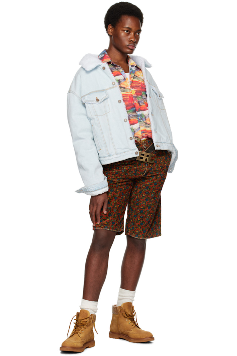 Cotton poplin shirt. Graphic pattern printed throughout. 

· Spread collar
· Button closure
· Patch pocket at chest
· Logo embroidered at front
· Shirttail hem
· Two-button barrel cuffs
· Box pleat at back yoke

Supplier color: Red Sunset