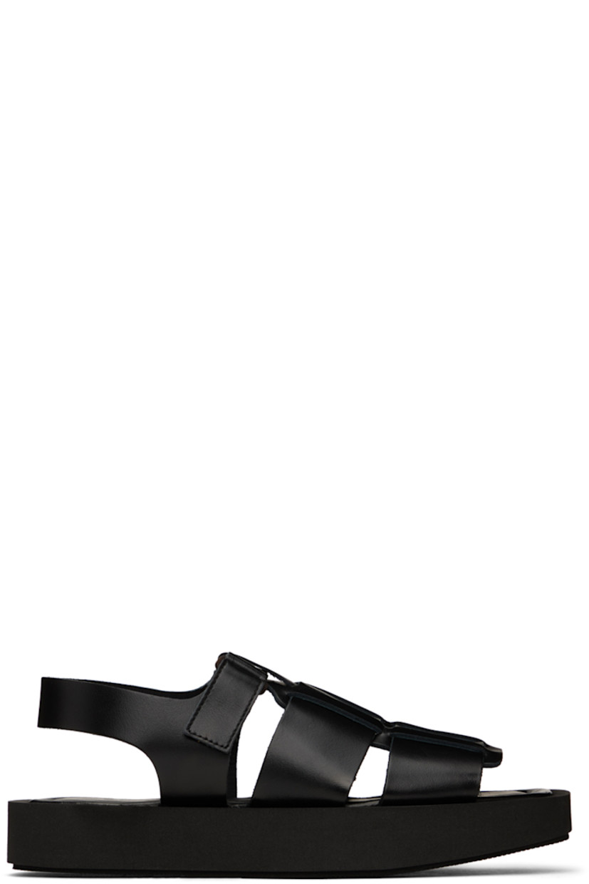 LWG-certified buffed leather sandals in black.

· Open square toe 
· Velcro strap at vamp 
· Padded footbed 
· Foam rubber platform midsole 
· Treaded foam rubber outsole
· Platform: H1.25 in

Supplier color: Black
