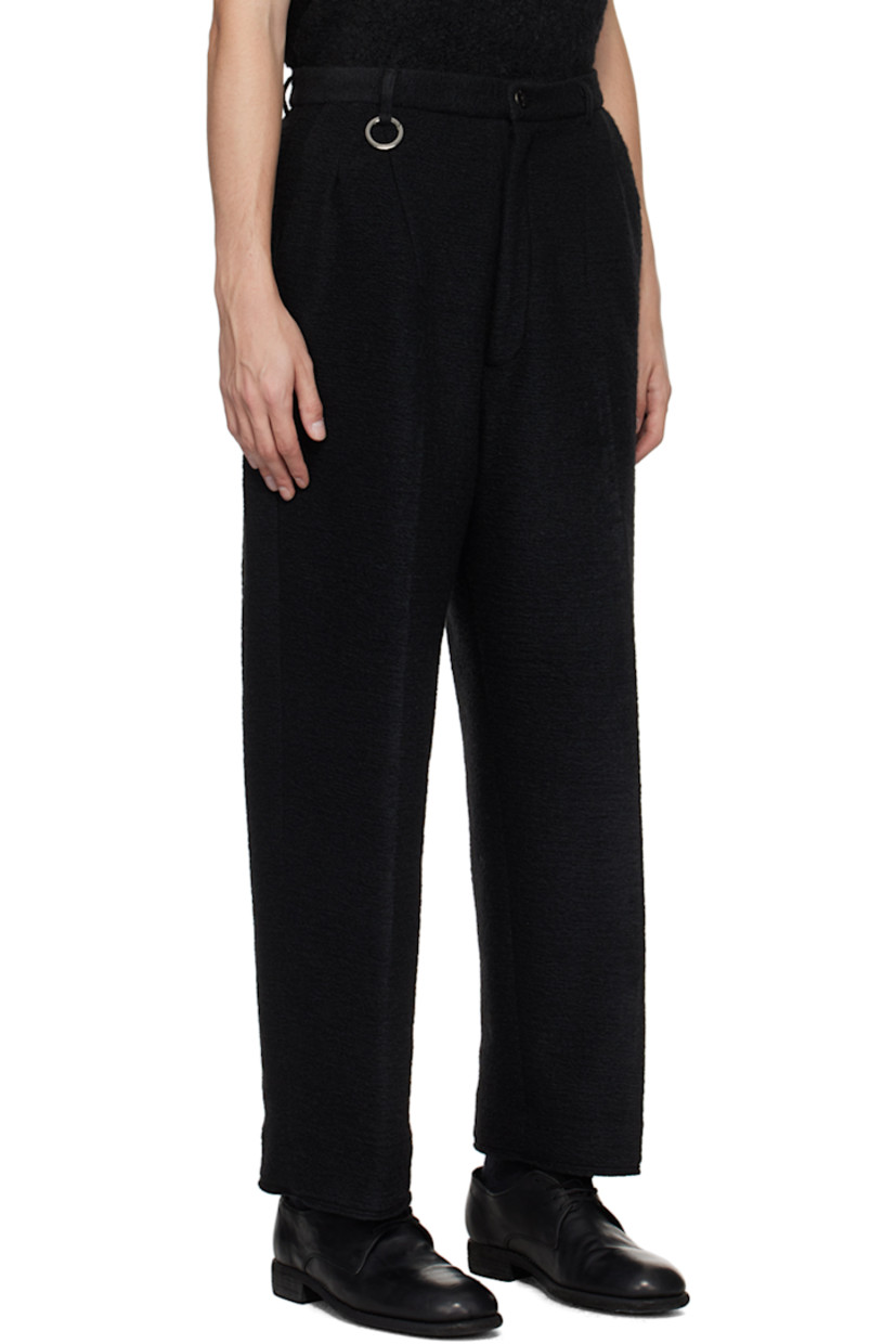 Wide-leg tapered polyester- and wool-blend flannel trousers.

· Concealed drawstring at waistband
· Three-pocket styling
· Zip-fly
· O-ring and darts at front

Supplier color: Black