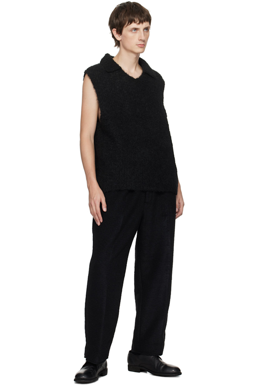 Wide-leg tapered polyester- and wool-blend flannel trousers.

· Concealed drawstring at waistband
· Three-pocket styling
· Zip-fly
· O-ring and darts at front

Supplier color: Black