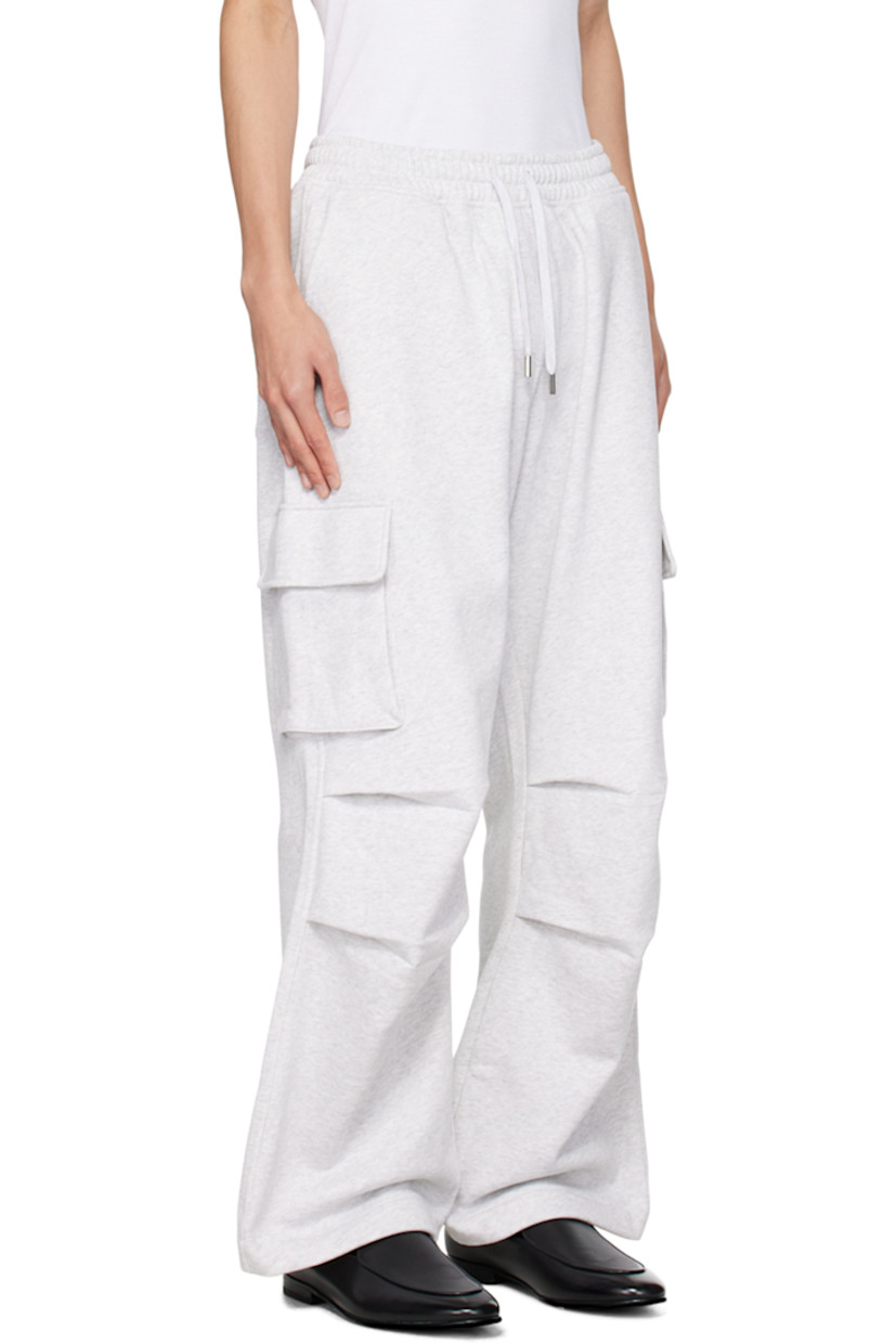 Cotton-blend fleece sweatpants.

· Drawstring at elasticized waistband
· Four-pocket styling
· Mock-fly
· Pleated knees
· Rubberized logo patch at outseam
· Cargo pocket at outseams

Supplier color: Pale grey melange
