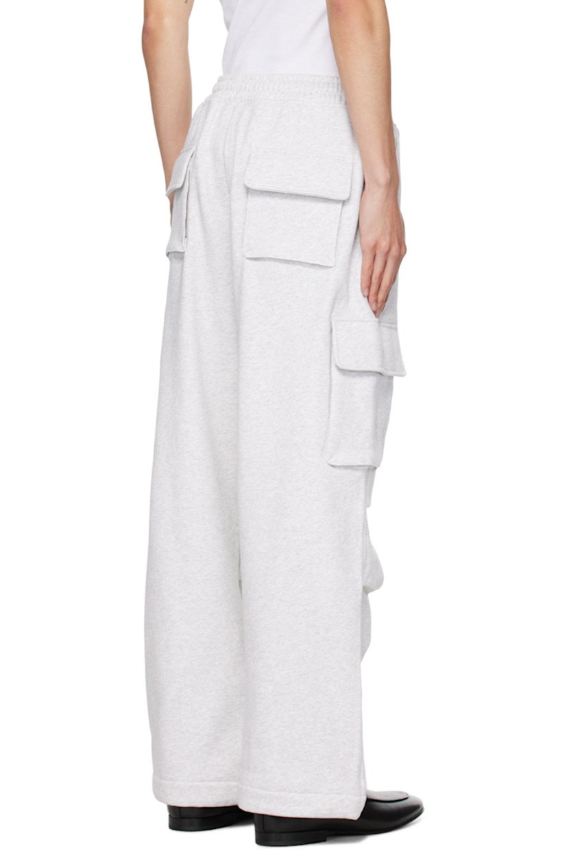 Cotton-blend fleece sweatpants.

· Drawstring at elasticized waistband
· Four-pocket styling
· Mock-fly
· Pleated knees
· Rubberized logo patch at outseam
· Cargo pocket at outseams

Supplier color: Pale grey melange