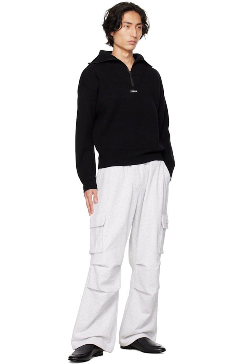 Cotton-blend fleece sweatpants.

· Drawstring at elasticized waistband
· Four-pocket styling
· Mock-fly
· Pleated knees
· Rubberized logo patch at outseam
· Cargo pocket at outseams

Supplier color: Pale grey melange