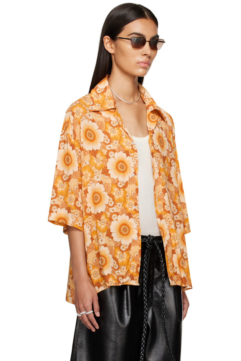 Plain-woven ECOVERO™ viscose shirt. Floral pattern printed throughout. 

· Spread collar
· Button closure
· Logo-engraved hardware

Supplier color: Wallpaper flowers