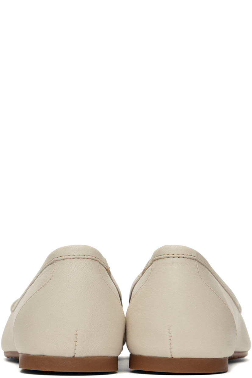 Nappa lambskin ballerina flats in off-white. 

· Logo hardware and appliqués at vamp
· Logo embossed at footbed
· Buffed goatskin lining
· Treaded rubber sole
· Gold-tone hardware

Supplier color: Ivory/Shiny gold