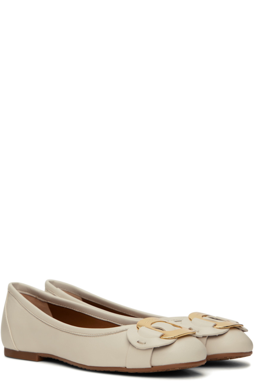 Nappa lambskin ballerina flats in off-white. 

· Logo hardware and appliqués at vamp
· Logo embossed at footbed
· Buffed goatskin lining
· Treaded rubber sole
· Gold-tone hardware

Supplier color: Ivory/Shiny gold