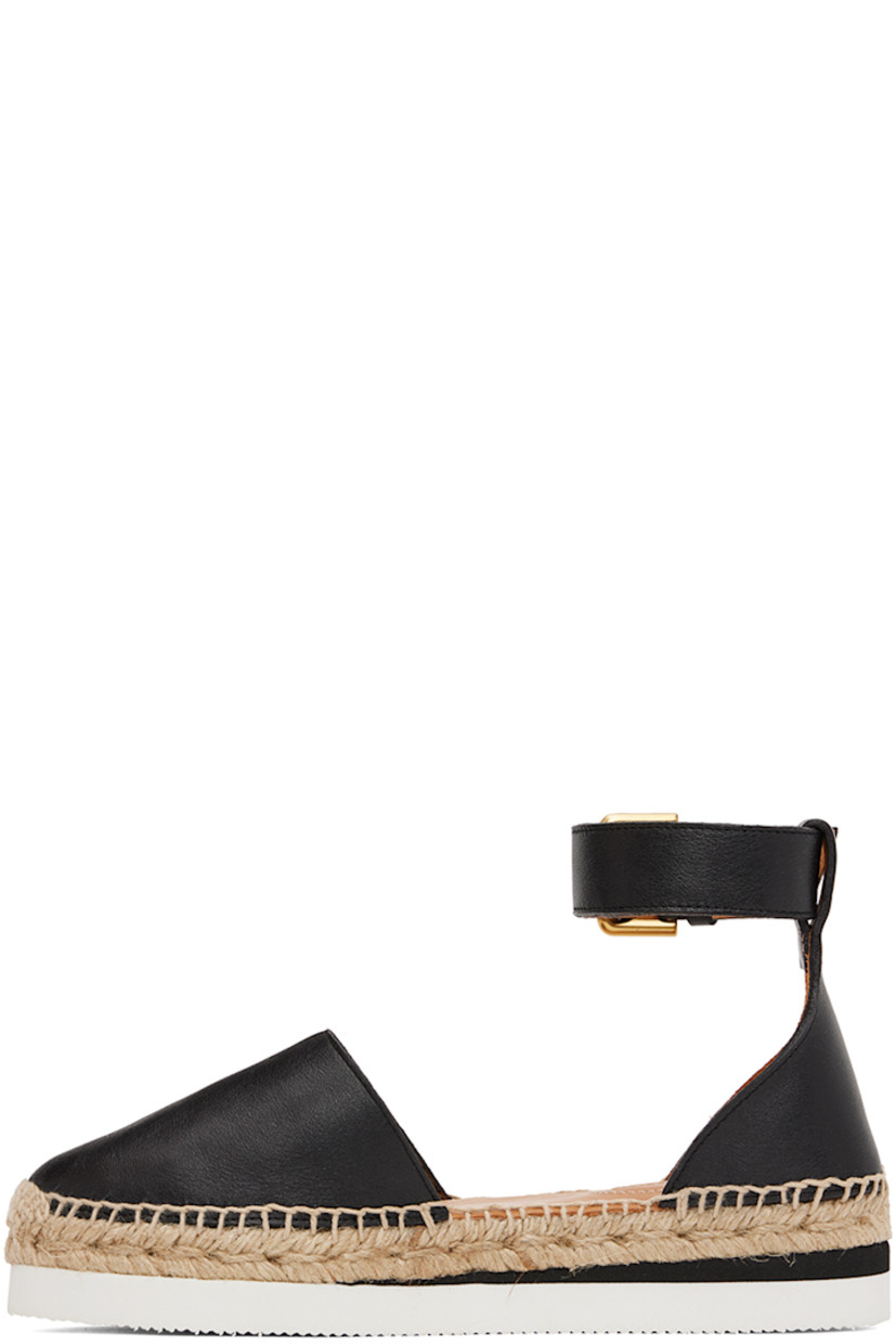 Grained calfskin espadrilles in black.

· Adjustable pin-buckle ankle strap
· Padded leather footbed
· Blanket stitching at welt
· Braided jute midsole
· Treaded foam rubber outsole 

Supplier color: Black