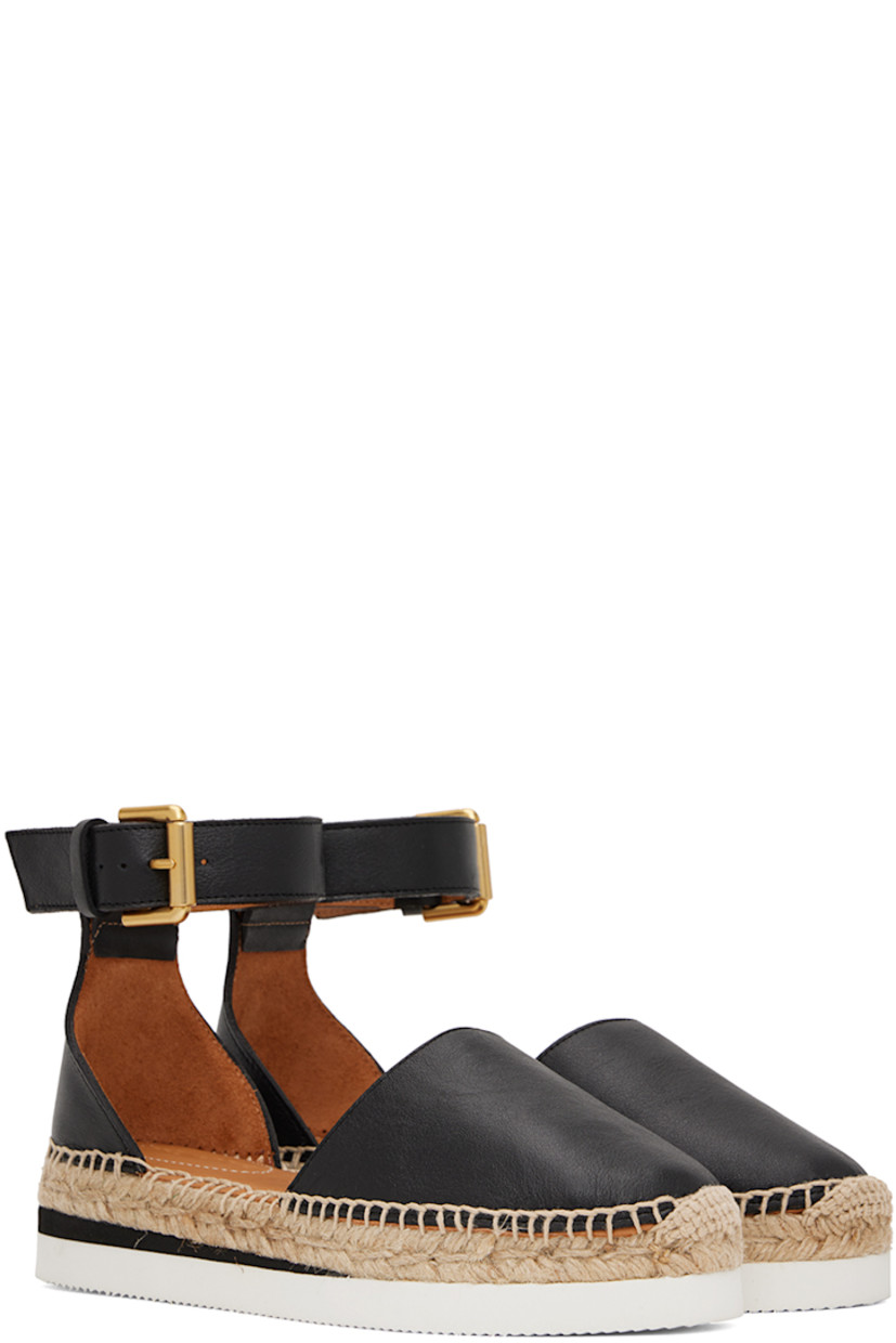 Grained calfskin espadrilles in black.

· Adjustable pin-buckle ankle strap
· Padded leather footbed
· Blanket stitching at welt
· Braided jute midsole
· Treaded foam rubber outsole 

Supplier color: Black
